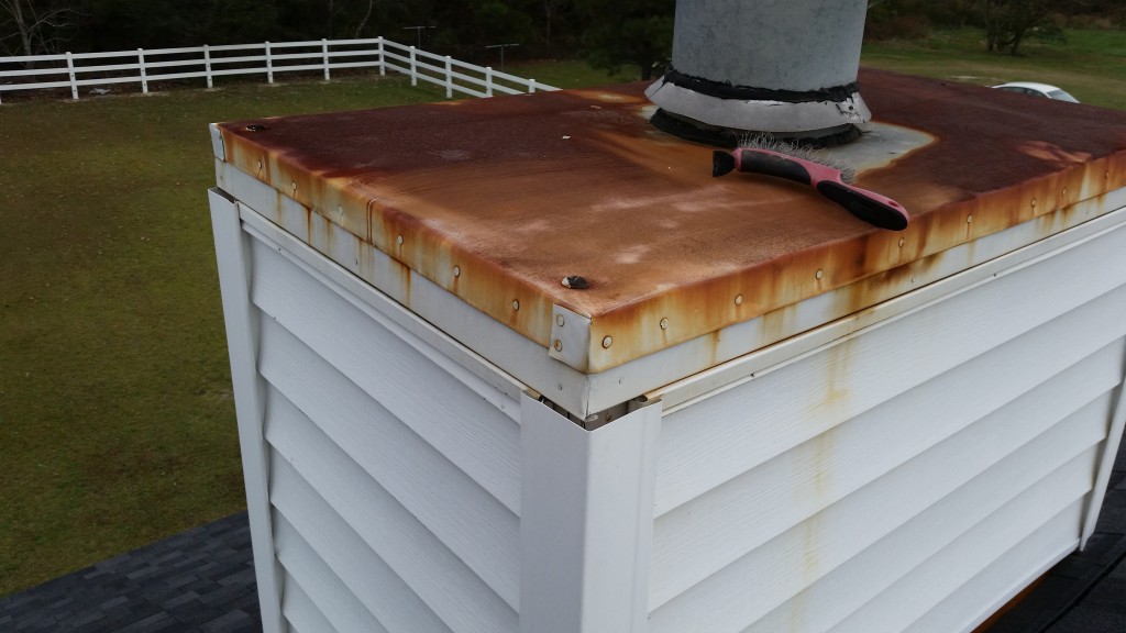 Rusted chimney caps not only look unsightly but the rust stains leech onto the underlying siding