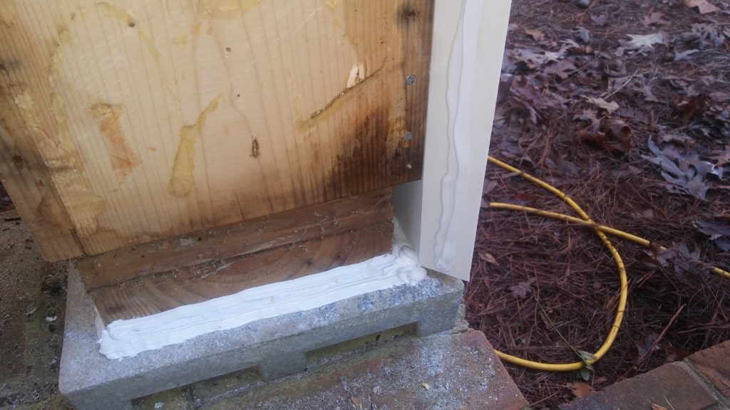 repairing a column base includes proper placement of caulking